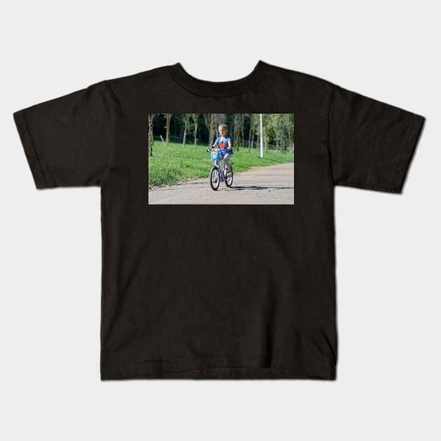 Child Little Girl Bicycling Kids T-Shirt by Westonalarmq